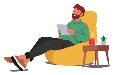 Man Seated Watching Tablet